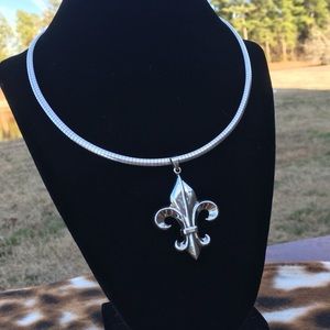 Fleur-de-lis pendant on sterling Omega necklace